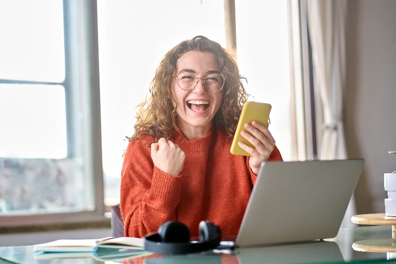 Young happy woman feeling excited