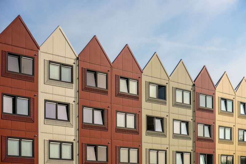 Bozeman, Montana Branch 24 A vibrant row of gableroofed residential buildings with meta 1782838821