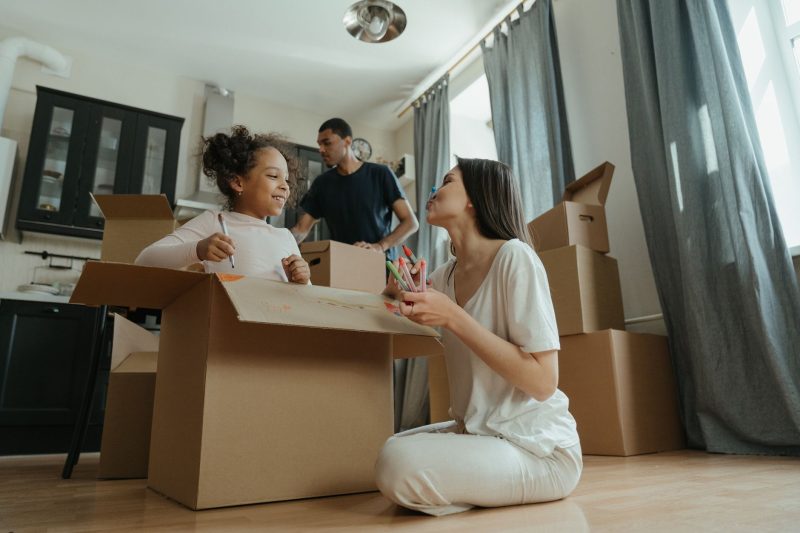 Great Falls, Montana Branch 24 A joyful family unpacking boxes while moving into their new 1793120483